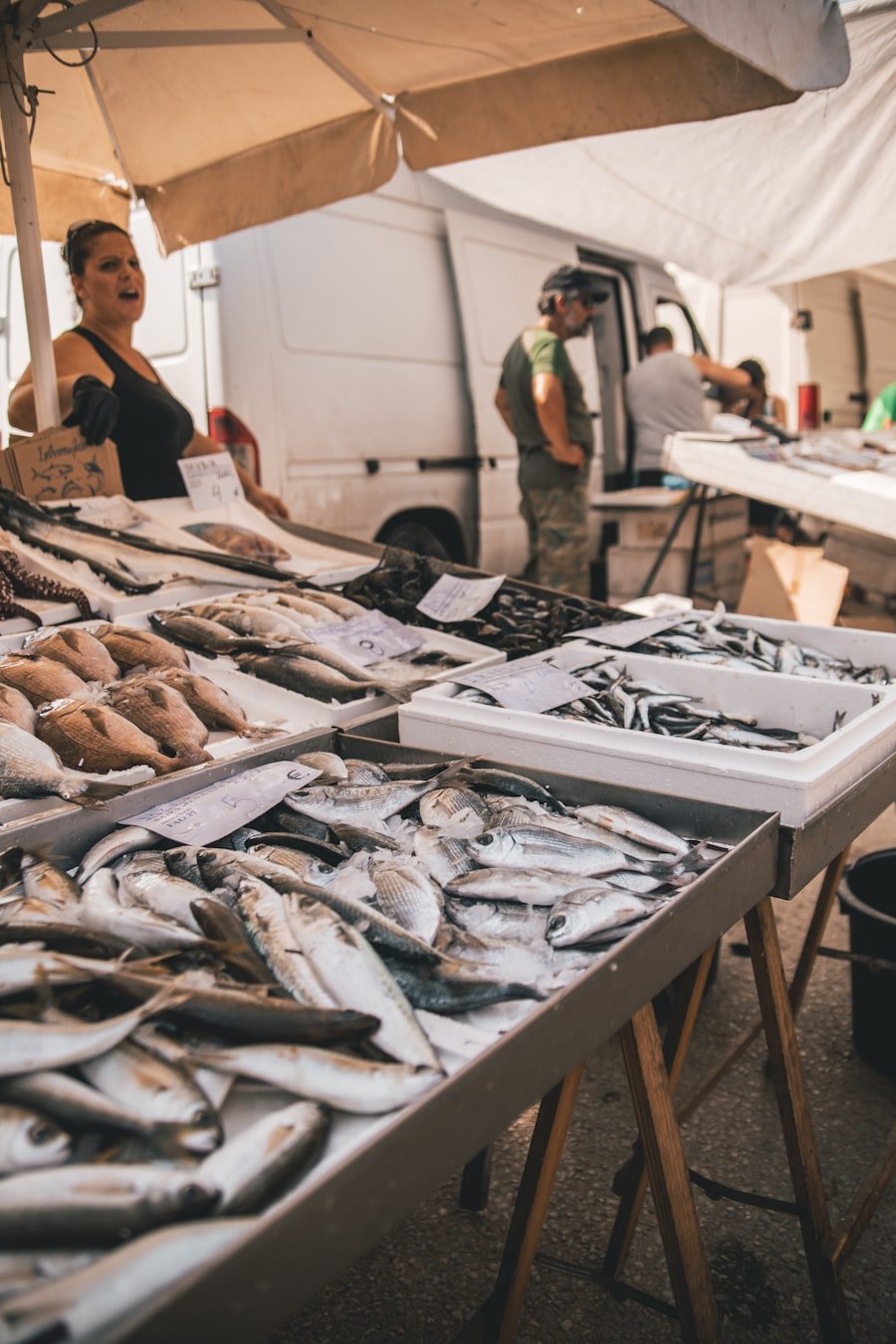 Fresh fish market display with vendor